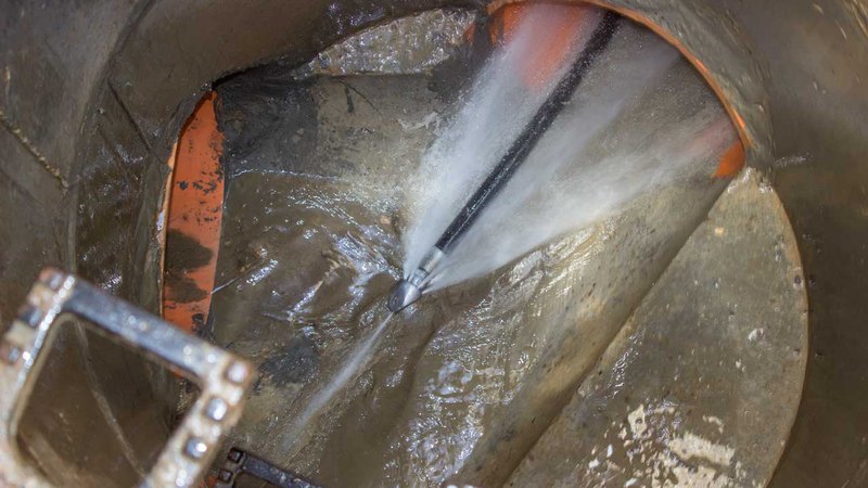 Thin hose inserted in a pipe for hydro jetting drain cleaning